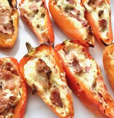 several stuffed bell peppers on a white plate