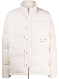 ivory white down-feather filling padded design quilted logo patch to the front high neck front press-stud and zip fastening drop shoulder long sleeves two side welt pockets straight hem White Duck Down Puffer Jacket With Padded Collar, White Cotton Puffer Outerwear, White Down Puffer Jacket For Streetwear, Casual White Duck Down Puffer Jacket, White Nylon Urban Puffer Jacket, White Long Sleeve Outerwear With Logo Patch, Winter Cotton Outerwear With Logo Patch, White Streetwear Outerwear With Logo Patch, White Puffer Jacket With Padded Collar For Streetwear