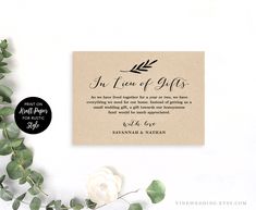 a wedding card with the words, an true of gifts on it next to some greenery