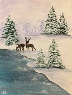 two deer standing next to each other on a snow covered field with trees in the background