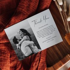 a thank card with an image of a woman and her dog on it next to some dried flowers