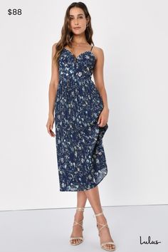 Everyone will want to celebrate how gorgeous you look in the Lulus Poise and Perfection Navy Floral Print Pleated Midi Dress! Lightweight woven chiffon, with a romantic floral print throughout, shapes adjustable spaghetti straps that support a bodice with triangular cups, piping trim, and a set-in waist. Skirt has a luxe pleated texture and falls to a midi hem. Hidden zipper/clasp at the side. Fit: This garment fits true to size. Length: Mid-calf length. Size medium measures 41" from adjustable straps to hem. Bust: Great for any cup size. Waist: Fitted - very fitted at natural waist. Hip: Not Fitted - fuller skirt allows room for hips. Undergarments: May be worn with a strapless bra, adhesive bra, petals, or no bra. Fabric: Fabric has no stretch. Lined. Shell: 100% Polyester. Lining: 88% P Casual Wedding Guest Dresses, Midi Dress Chic, Blue Floral Midi Dress, Romantic Floral Print, Dresses Lulus, Casual Sundress, Casual Formal Dresses, Pipe Dream, Lulus Dresses