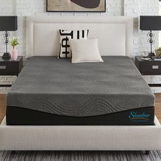 an image of a bedroom setting with mattress and pillows