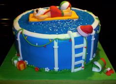 a birthday cake that looks like an inflatable pool with a person floating on it