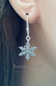 These sterling silver snowflake earrings are very pretty! The detailed snowflake charm is sterling silver and measures (without the attached ring) 14.5mm or .57 inches in diameter. The leverback is sterling silver with a tear drop accent. These lovely earrings are ready to ship and will arrive in a gift box. Check out the matching Snowflake Necklace and other snowflake jewelry here: https://www.etsy.com/shop/BrattonCraft?ref=listing-shop2-all-items-count&search_query=snowflake Check out othe Snowflake Shaped Jewelry With Matching Earrings For Gifts, Sterling Silver Dangle Jewelry For Christmas, Elegant Winter Gift Earrings, Nickel-free Sterling Silver Christmas Earrings, Silver Snowflake Earrings For Pierced Ears, Nickel-free Sterling Silver Earrings For Christmas, Nickel Free Sterling Silver Christmas Jewelry, Nickel-free Sterling Silver Christmas Jewelry, Holiday Silver Drop Earrings