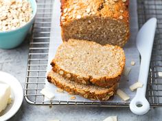 sliced loaf of oatmeal bread on cooling rack