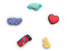 Personalize your favorite pair of Crocs with the Peace Love Outdoors Jibbitz set! This pack comes with a turtle, peace hand, water bottle, heart, and clog charm to show off your fun side. White Croc Jibbitz Ideas, Croc Jibbitz Ideas, Croc Pins, Unrealistic Wishlist, Croc Jibbitz, Pretty Gifts