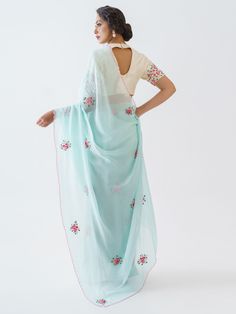 This is a three-piece light blue floral saree set from the Suruchi Parakh collection. The light blue floral saree is paired with an embroidered off-white blouse. The blouse has padding and a back hook opening with a cut-out detail. There are beautiful floral motifs of zardozi, pearl and thread work all over the blouse and saree. This saree set is crafted in soft organza and tussar silk fabrics. The outfit is completed with an inner skirt for the saree.
Clutch NOT included. Light Blue Saree Set With Unstitched Blouse, Semi-stitched Bollywood Saree For Spring, Festive Light Blue Pre-draped Saree, Georgette Saree For Spring, Georgette Saree For Spring Festival, Spring Georgette Saree, Spring Festival Georgette Saree, Spring Festive Unstitched Saree, Light Blue Pre-draped Saree For Wedding