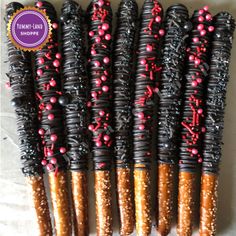 chocolate covered pretzels with sprinkles are arranged on a white surface