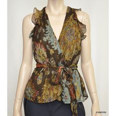 Lauren Ralph Lauren 'Catlyi' Sleeveless Printed Ruffled Blouse Lauren By Ralph Lauren's Breezy Silk Georgette Top Is Crafted With Feminine Cutout Shoulders And Delicate Ruffles. Size 2: Length - 22"; Width (Armpit To Armpit) - 17.5" Size 4: Length - 22.5"; Width (Armpit To Armpit) - 18" * Color: Brown/Multi * Wrap Construction * Crossover V-Neckline * Sleeveless Silhouette * Cutout Shoulders * Ruffles At The Armholes * Self-Ties At The Waist * Shell: 100% Silk * Lining: 100% Polyester * Dry Clea Spring Brown Silk Blouse, Brown Silk Blouse For Spring, Elegant Sleeveless Brown Tops, Sleeveless Silk Blouse With Ruffles, Sleeveless Silk Top With Floral Print, Brown Silk Tops For Spring, Brown Silk Top For Spring, Spring Brown Silk Top, Brown Silk Summer Tops