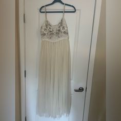 Never Worn White Floor-length Midi Dress For Spring, White Tulle Maxi Dress For Wedding, Cream Flowy Dress For Party, Cream Flowy Party Dress, Flowy Cream Party Dress, Spring White Embellished Midi Dress, White Flowy Maxi Dress For Wedding, Flowing White Maxi Dress For Bridesmaids, White Tulle Midi Dress For Party