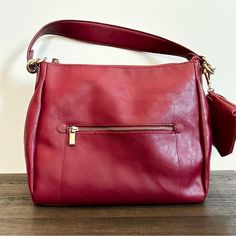 Shoulder Bag / Crossbody Pretty Cranberry Color Can Be Worn As A Shoulder Bag Or Crossbody Comes With Matching Little Pouch Faux Leather Has Top Handle And Longer Adjustable Strap Condition: New Without Tags Red Faux Leather Satchel, Red Faux Leather Shoulder Bag With Zipper Closure, Red Faux Leather Shoulder Bag, Red Faux Leather Bags For Everyday Use, Red Faux Leather Bag For Everyday Use, Red Faux Leather Travel Shoulder Bag, Red Faux Leather Shoulder Bag For Travel, Burgundy Faux Leather Shoulder Bag For Everyday Use, Travel-ready Burgundy Hobo Bag With Zipper Closure