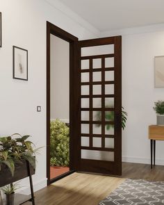 an open door in a white room with potted plants