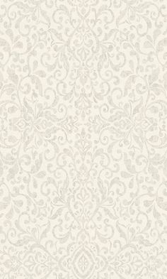 the back side of a white wallpaper with an ornate design on it, and text that