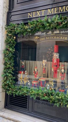 a window display with christmas decorations and nutcrackers