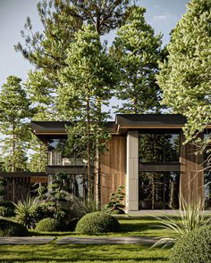 the house is surrounded by trees and grass