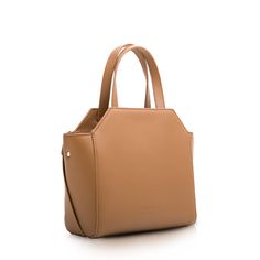 Inspired by the Cubist works of Geroge Braque, this brown bag boasts a unique silhouette with a prominent knot detail that adds an artistic touch; Split cattle leather; Polyester lining; Gold-tone hardware; Down zipper closure; Size: 8.0"W x 8.0"H x 3.5"D (20cm W x 20cm H x 9cm D); Adjustable crossbody strap drop: 18.5" - 21.2"; Weight: 1.1 lbs Minimal Bags, Leather Bags For Women, Drawstring Bucket Bag, Leather Bucket Bag, Leather Bucket, Brown Bags, Handle Bag, Leather Bags, White Bag