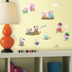 peppa pig wall stickers on the side of a white table next to a lamp