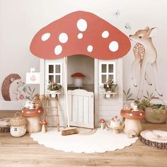 there is a doll house with mushrooms on the floor