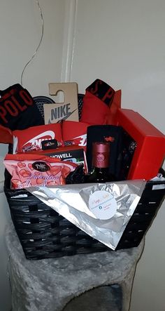 a black basket filled with lots of different items