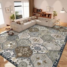 a large sectional couch sitting on top of a rug in a living room next to a window