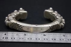 A rare single medium-size solid silver bracelet. These are worn by women of various tribal groups for centuries. Oxidize silver, in good condition. wt: 202g diameter: 6cm Inner circumference: 14cm outer circumference: 22cm Origin: Nepal 19th c Traditional Sterling Silver Bracelet For Ceremonial Occasions, Traditional Ceremonial Sterling Silver Bracelet, Traditional Sterling Silver Bracelet, Traditional Antique Silver Bracelets For Ceremonial Use, Traditional Antique Silver Bracelets For Rituals, Traditional Antique Silver Bracelets For Ceremonial Occasion, Traditional Antique Silver Bracelets For Ceremonies, Antique Silver Traditional Bracelet For Rituals, Heavy Silver Bracelets For Ceremonial Occasions