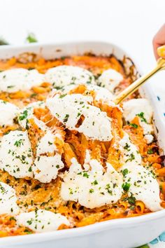 a casserole dish is topped with cheese and parmesan