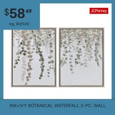 two framed paintings with leaves hanging from them