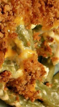 green bean casserole with crumbs and cheese on the top is ready to be eaten