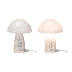 two mushroom shaped lamps sitting next to each other