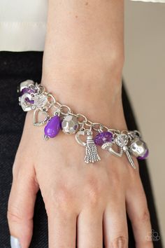 A collection of crystal-like, purple teardrop, and faceted silver beads join a variety of shimmery silver charms around the wrist for a whimsical look. Features an adjustable clasp closure. Sold as one individual bracelet. P9WH-PRXX-199XX Paparazzi Accessories Jewelry, Feather Bracelet, Nickel Free Jewelry, Purple Bracelet, Teardrop Beads, Silver Charm Bracelet, Paparazzi Accessories, Affordable Jewelry, Bracelet Clasps