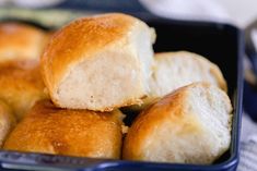 several rolls in a blue container on a table