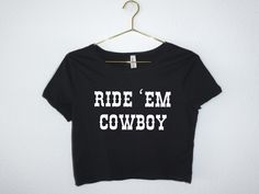 "This \"Ride Em\" Western cropped top tee country inspired Bella Canvas shirt will be your new favorite way to celebrate your next country concert, rodeo, festival or Nashville trip.  This crop tee has a slim fit and it's cut just above the belly button to show off the figure.  Please note this shirt runs small. It's meant to fit like a tight crop top, so please check sizing  We don't accept returns or exchanges. Message us for custom or bulk orders. Every item is custom produced, made to order, Crop Top Western, Tight Crop Top, Nashville Trip, Rodeo Shirts, Country Concerts, Country Concert, Crop Top Tees, Crop T Shirt, Cow Girl