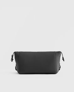 Our All-Day Neoprene Toiletry Bag is the sleek travel accessory you'll never want to leave home without. The spacious interior and multiple compartments allow you to neatly organize your toiletries, cosmetics, and additional travel necessities. Plus, it's made from 4 recycled water bottles for a look that’s equally conscious and cool.  | Quince | Women's All-Day Neoprene Toiletry Bag in Black Silk Pajamas Shorts, Silk Pajama Pants, Gold Chain Link Necklace, Silk Tee, Travel Necessities, Bezel Necklace, Silk Tank, Bezel Diamond, Chain Link Necklace