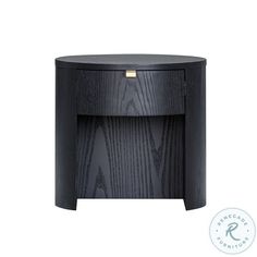 the side table is made out of black wood and has a gold emblem on it