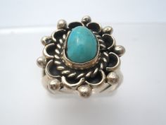 Southwestern Jewelry - This is a handmade sterling silver ring with sn overlay technique and a blue turquoise gemstone center. The ring is a size 5.5, face measures .88" by .75" and weight is 5.1 grams. It is not hallmarked, tests for sterling silver. Blue Artisan Turquoise Ring Nickel Free, Artisan Blue Turquoise Ring Stamped 925, Artisan Turquoise Ring Stamped 925, Blue Sterling Silver Ring With Patina, Blue Sterling Silver Rings With Patina, Southwestern Blue Turquoise Ring With Patina, Vintage Turquoise Ring, Handmade Sterling Silver Rings, Southwestern Jewelry