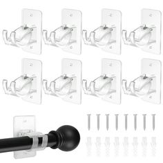 eight black and white wall mounted toilet paper dispenser attachments with 8 clips