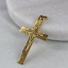 This flat, ornate cross features beautiful diamond-cut detailing on the front with a plain polished back and has been crafted in 18k yellow gold. Metals: 18k yellow gold  Approx. 35.6 x 21.2 mm (without the bail and loop), 3.4 grams NOTE: This cross does not come with a chain. If you are interested in a chain, please contact us and we will work with you to find the perfect chain from the extensive selection of chains we offer. Please allow up to 5 business days for processing. Currently only shipping within Canada and USA. | c u r a t e d | Visit our website for curated and modern pieces  https://www.menkduke.com | f a c e b o o k | Follow us on Facebook for new item announcements and discounts  https://www.facebook.com/menkDUKE/ | i n s t a g r a m | Follow us on instagram to see what we' Ornate Cross, Cross Christian, Christian Necklace, Gold Flats, Bridal Gift, Cross Charms, Religious Jewelry, Bridal Gifts, Diamond Cut