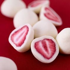 some white and red candy on a red table