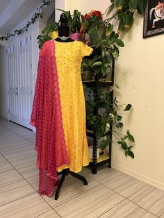 muslin silk anarkali gown with bandini print all over.  Yellow dress with pink duppatta: size 36in and extendable to 40in Yellow dress with green duppatta: size 38in and extendable to 42in Pink dress: size 38in and extendable to 40in Anarkali Party Wear, Silk Anarkali Gown, Yellow Anarkali, Contrast Dupatta, Silk Anarkali, Yellow Gown, Kurti Sets, Maggam Work Blouses, Anarkali Gown