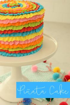 there is a cake that has been decorated with multicolored ruffles on it