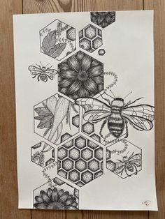 a drawing of bees and honeycombs on white paper with brown wood planks