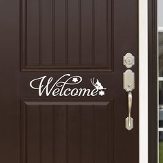 a welcome sign on the front door of a house