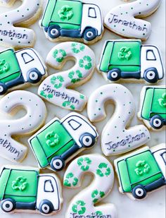 decorated cookies in the shape of numbers and trucks