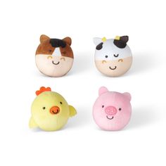 four small stuffed animals in different colors and sizes