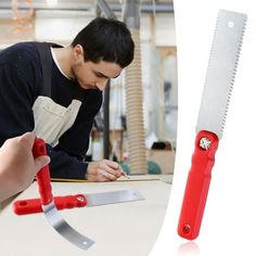 a man is working with scissors on a table next to a pair of red handled knives