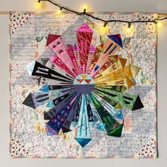 a quilted wall hanging with lights on it