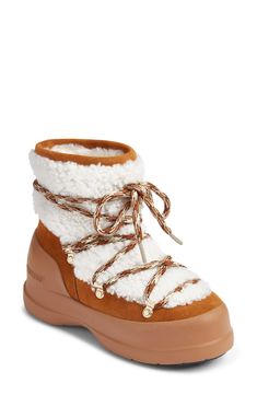 Inspired by traditional hiking styles, this suede boot boasts cloud-like genuine shearling and multicolored laces with gleaming goldtone hardware for added style points. 1 1/4" heel 9" shaft Lace-up style Water repellent Removable, cushioned insole with arch support Leather and genuine-shearling (Italy) upper/leather lining/rubber sole Made in Spain Boots Cognac, Moon Boot, Sheep Skin, Hiking Fashion, Italian Shoes, Shearling Boots, Ankle Boots Flat, Moon Boots, Shoe Company