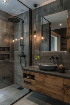 a bathroom with a sink, mirror and shower stall in it's own area