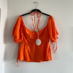 Staud Orange Top, Size 4, 100% Polyester, Dry Clean Only, Off The Shoulder Tied Sleeves, Tie For Around The Neck, Zipper On The Side Spring Party Top With Tied Details, Spring Party Tops With Tied Details, Spring Casual Staud Tops, Casual Staud Tops For Spring, Casual Spring Tops By Staud, Casual Staud Summer Top, Casual Staud Tops For Summer, Casual Summer Tops By Staud, Chic Staud Tops For Spring